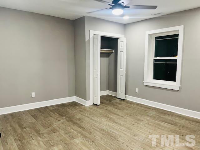 8781 Mill Branch Road Rocky Mount, NC 27803 - Photo 14 of 19 a view of an empty room with window and chandelier fan