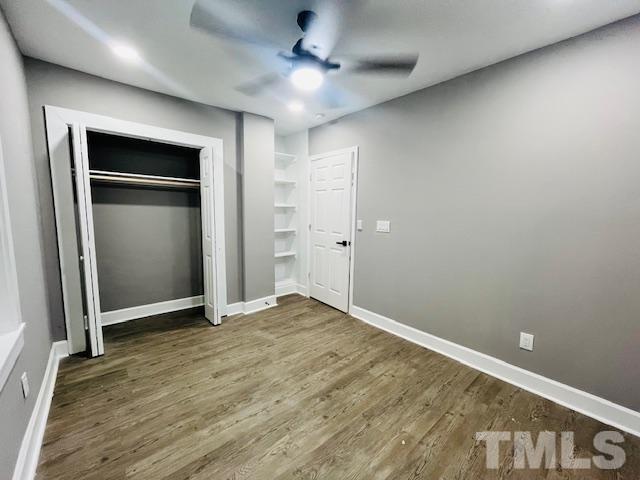 8781 Mill Branch Road Rocky Mount, NC 27803 - Photo 15 of 19 an empty room with closet and a ceiling fan