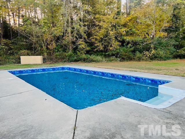 8781 Mill Branch Road Rocky Mount, NC 27803 - Photo 19 of 19 a view of a swimming pool with an outdoor space