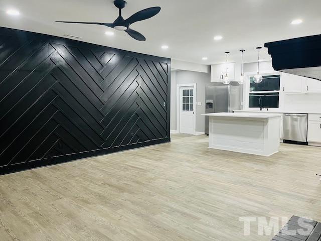 8781 Mill Branch Road Rocky Mount, NC 27803 - Photo 2 of 19 a view of kitchen with microwave and refrigerator