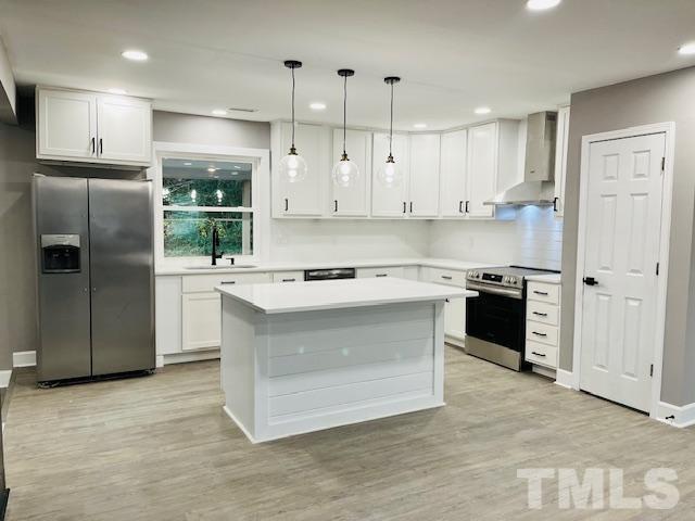 8781 Mill Branch Road Rocky Mount, NC 27803 - Photo 4 of 19 a kitchen with stainless steel appliances granite countertop a stove a refrigerator and a sink