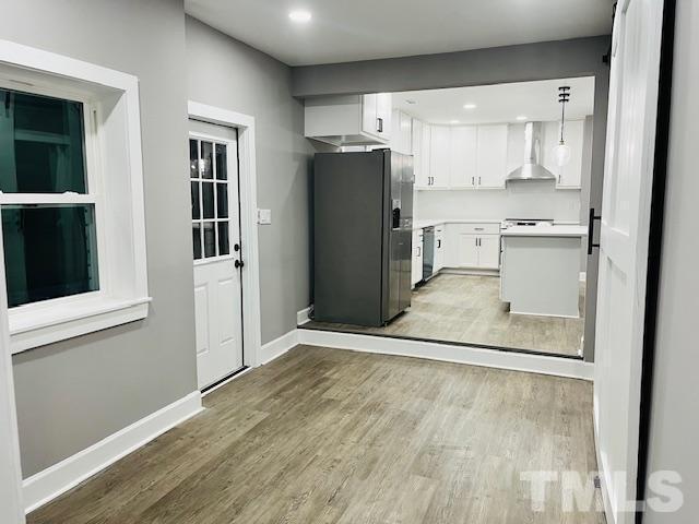8781 Mill Branch Road Rocky Mount, NC 27803 - Photo 5 of 19 a view of a kitchen with a sink and a refrigerator