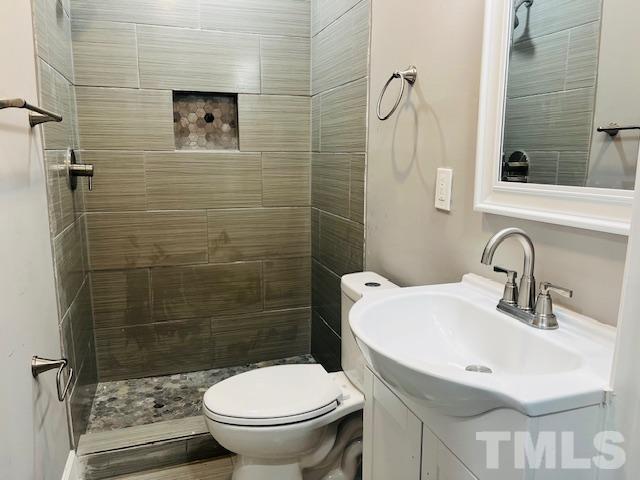 8781 Mill Branch Road Rocky Mount, NC 27803 - Photo 8 of 19 a bathroom with a sink toilet and shower