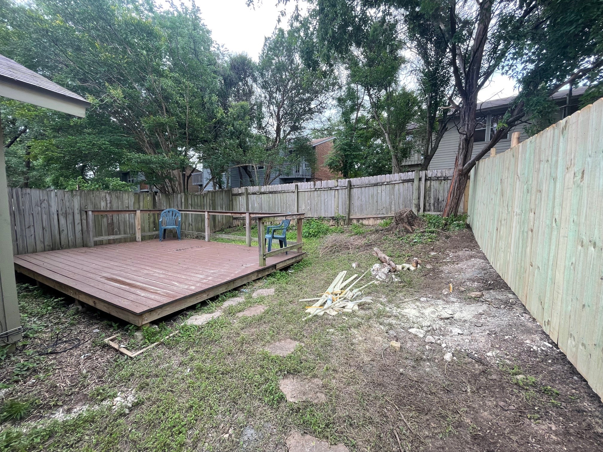1411 Waterloo Trail, Unit B Austin, TX 78704 - Photo 14 of 15 a view of a backyard with a small cabin and wooden fence