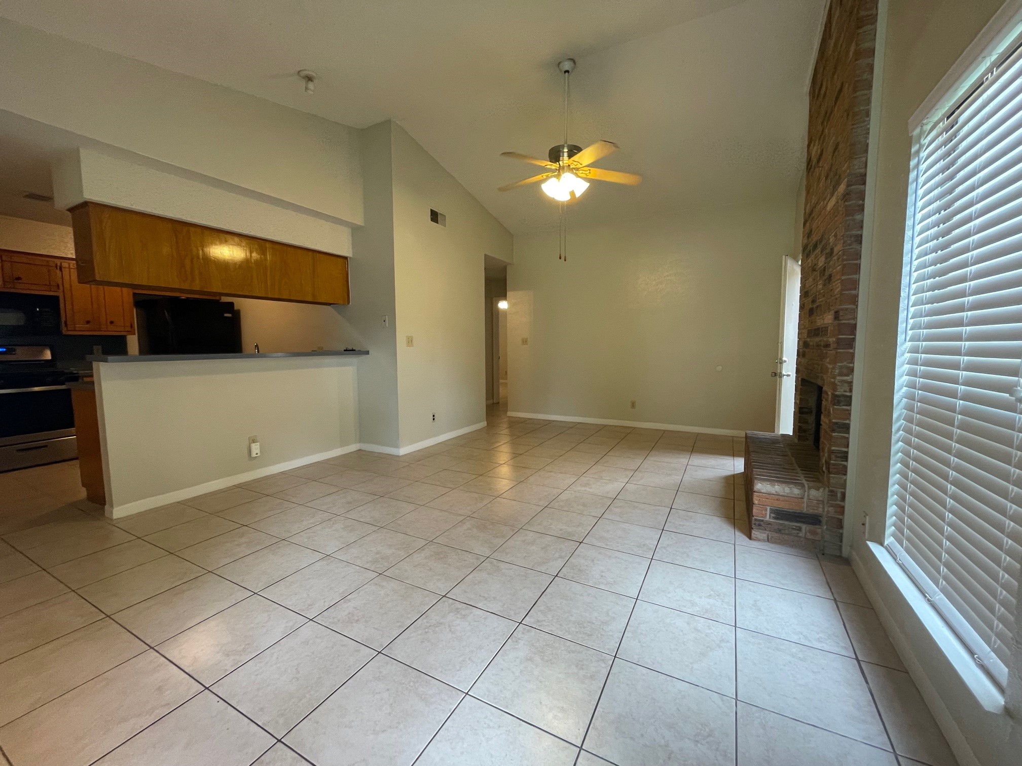 1411 Waterloo Trail, Unit B Austin, TX 78704 - Photo 2 of 15 a view of a livingroom with an empty space and a window