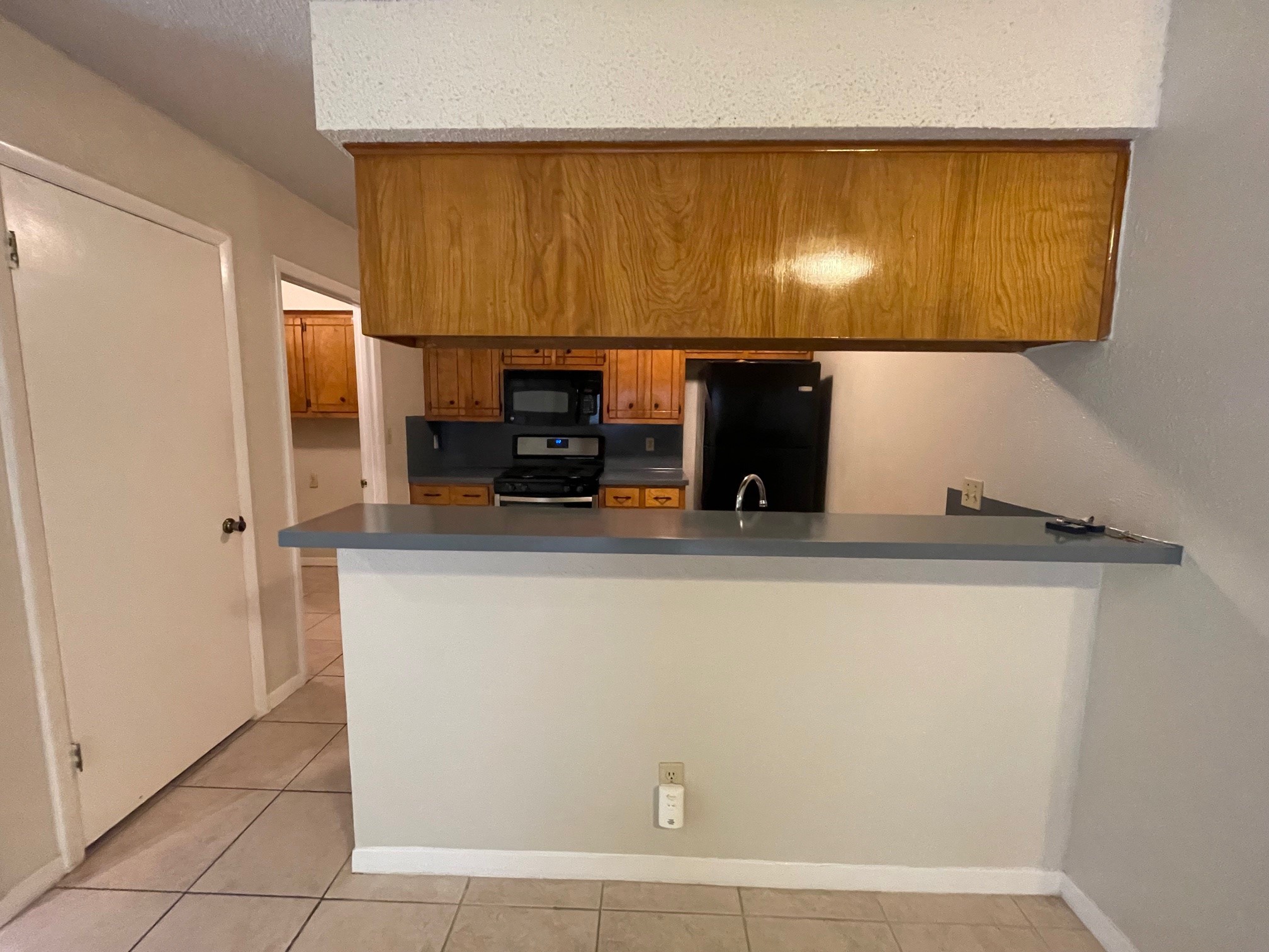 1411 Waterloo Trail, Unit B Austin, TX 78704 - Photo 8 of 15 a view of a kitchen with stainless steel appliances wooden floor
