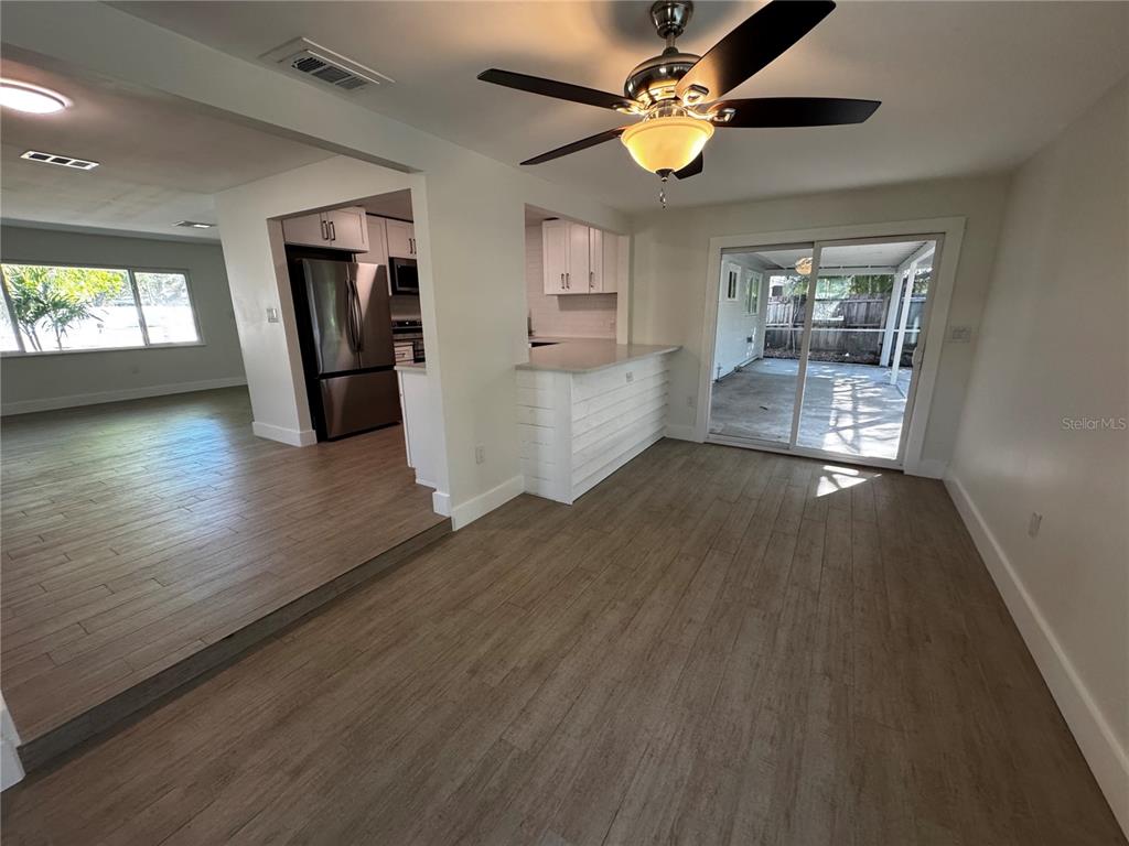 3182 Hatton Street Sarasota, FL 34237 - Photo 14 of 22 wooden floor in an empty room with a window