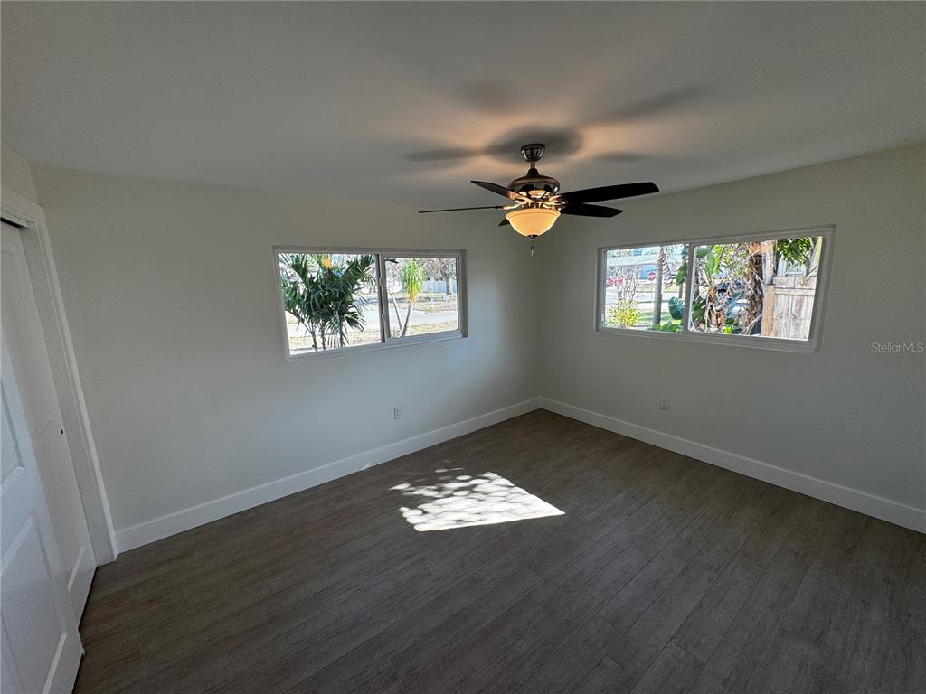 3182 Hatton Street Sarasota, FL 34237 - Photo 16 of 22 wooden floor in an empty room with a window
