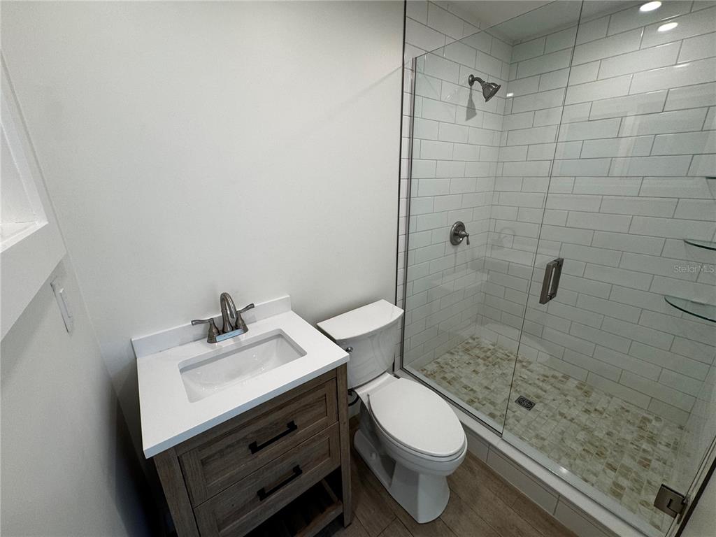 3182 Hatton Street Sarasota, FL 34237 - Photo 19 of 22 a bathroom with a sink a toilet and shower