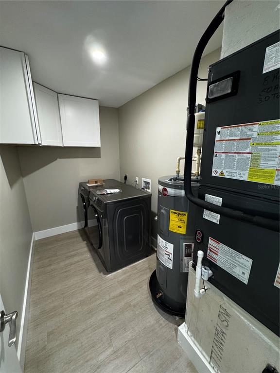 3182 Hatton Street Sarasota, FL 34237 - Photo 20 of 22 a kitchen with stainless steel appliances kitchen island granite countertop a stove and a wooden floors