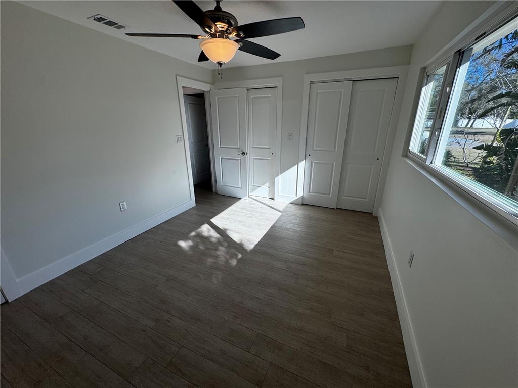 3182 Hatton Street Sarasota, FL 34237 - Photo 21 of 22 wooden floor in an empty room with a window