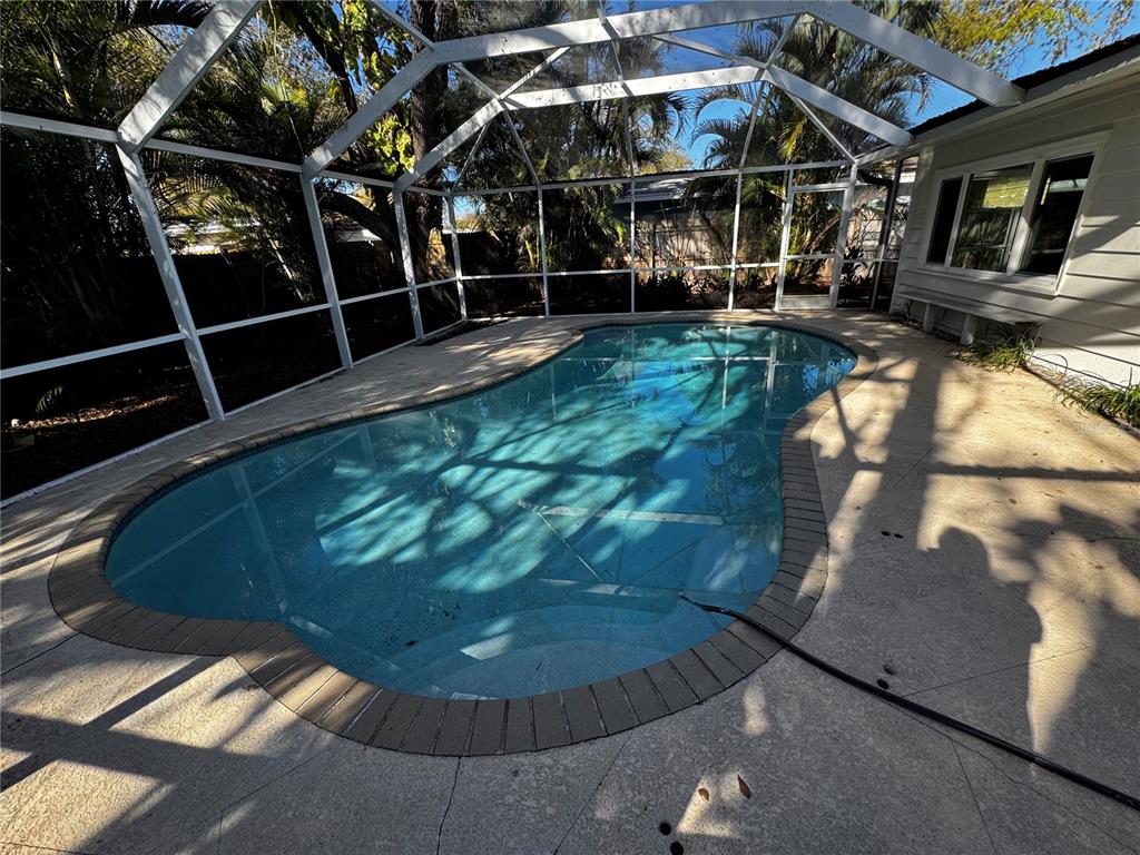 3182 Hatton Street Sarasota, FL 34237 - Photo 5 of 22 a view of a chairs and table in the patio