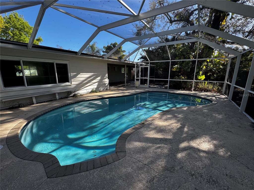 3182 Hatton Street Sarasota, FL 34237 - Photo 6 of 22 a view of a swimming pool with a patio