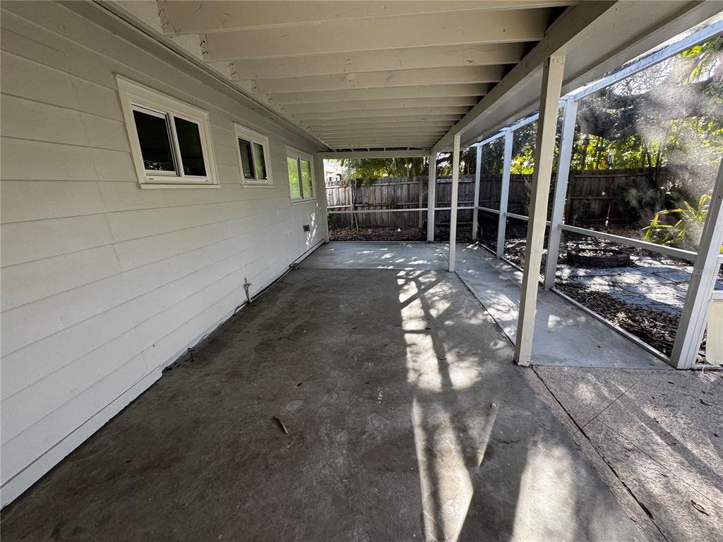 3182 Hatton Street Sarasota, FL 34237 - Photo 7 of 22 a view of backyard with porch