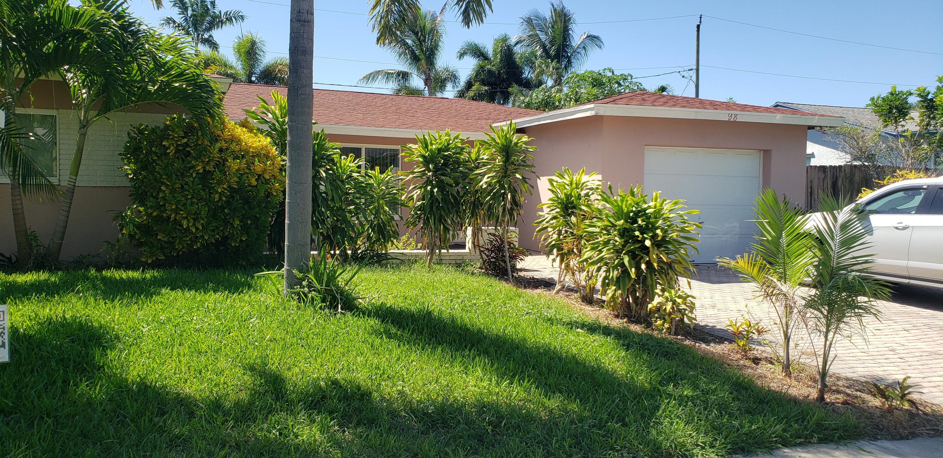 98 Seminole Lane Boca Raton, FL 33487 - Photo 25 of 42 a view of a house with a yard