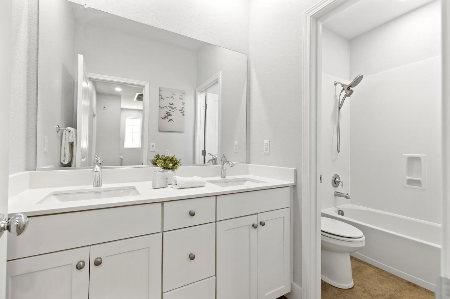 24253 Nora Circle Hayward, CA 94545 - Photo 22 of 49 a bathroom with a toilet a sink a tub and a mirror