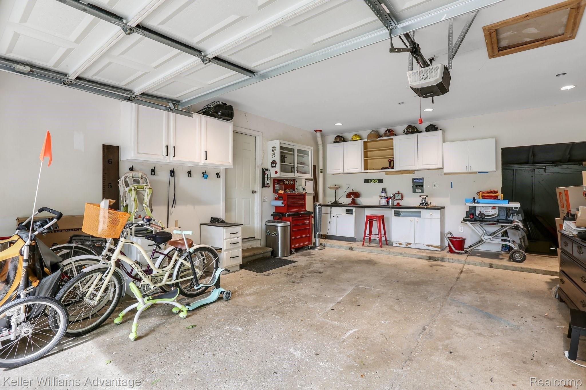 2636 Potter Road Wixom, MI 48393 - Photo 17 of 22 Large garage with additional work space and storage