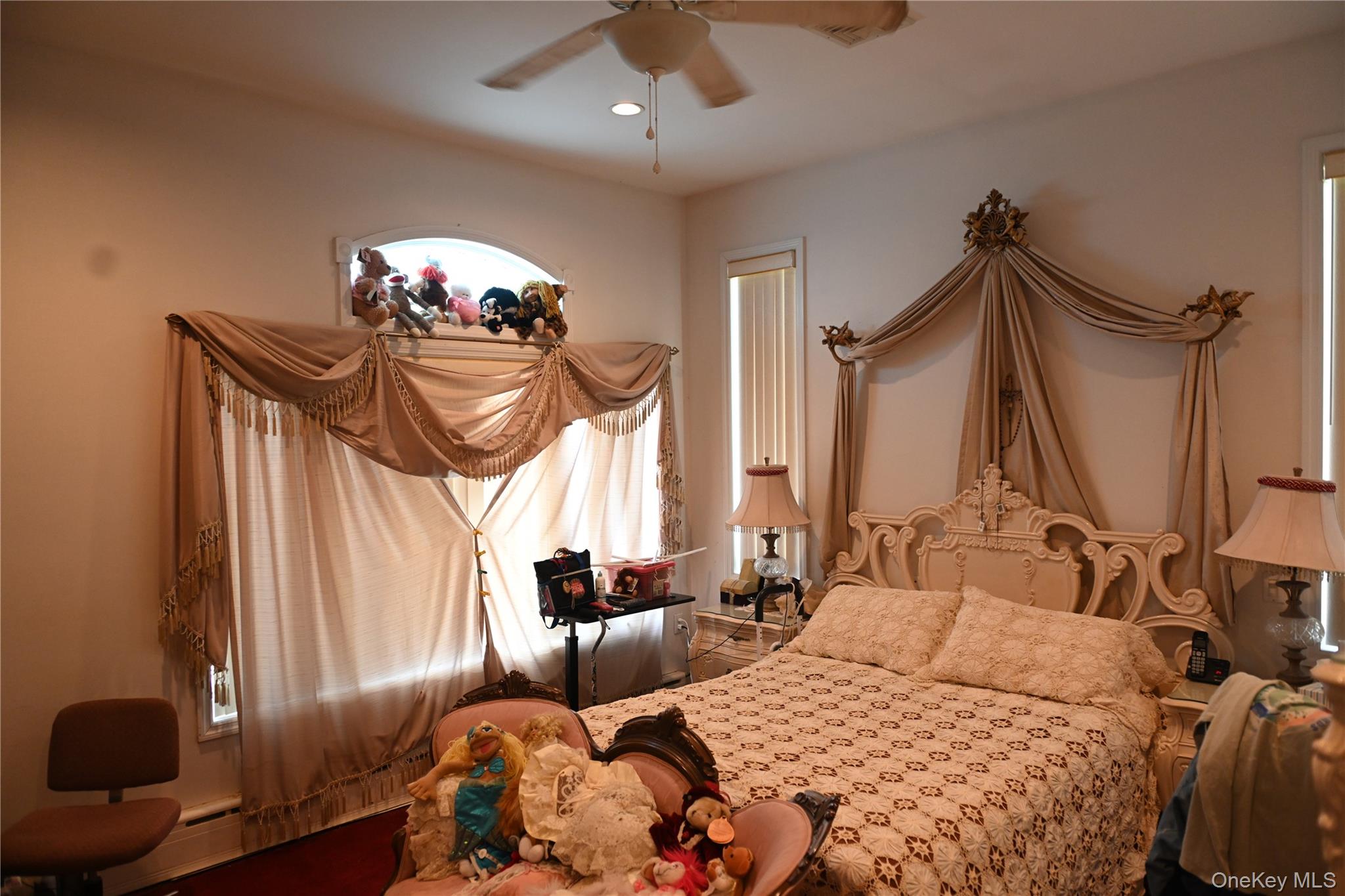 115 Riviera Drive Mastic Beach, NY 11951 - Photo 11 of 27 a bedroom with furniture and a window