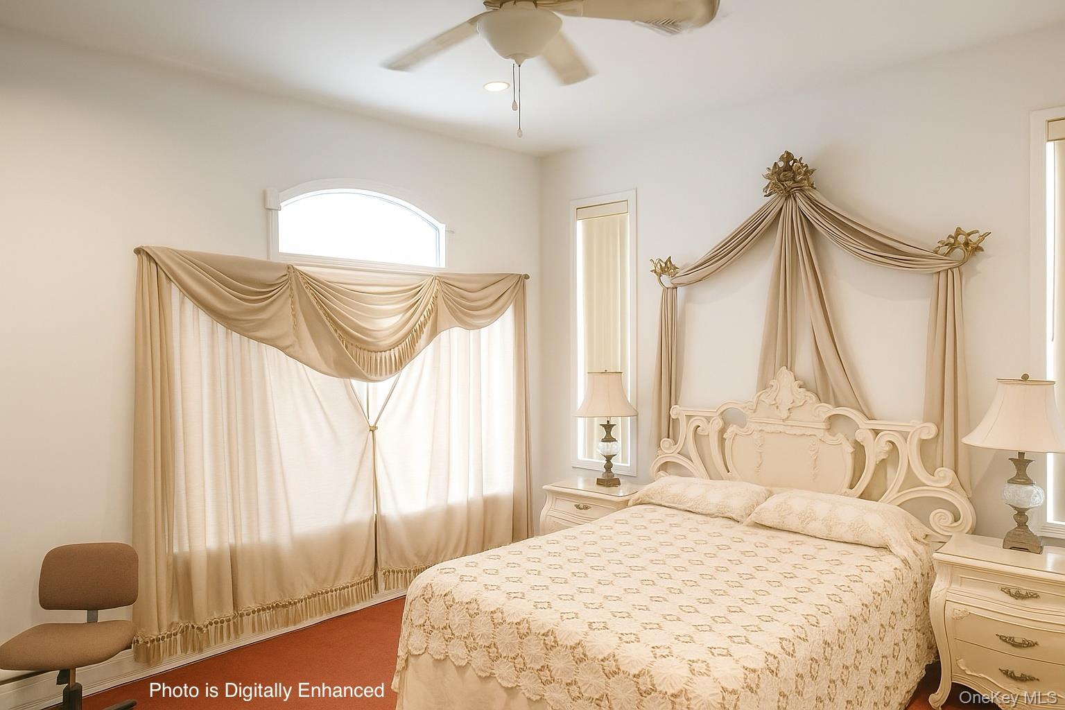 115 Riviera Drive Mastic Beach, NY 11951 - Photo 12 of 27 a bedroom with a bed and a chandelier