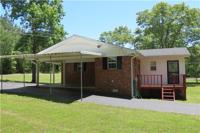 57 Butler Road Parsons, TN 38363 - Photo 15 of 19 side view of home with carport and deck