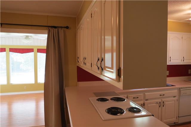 57 Butler Road Parsons, TN 38363 - Photo 4 of 19 Kitchen opened to eat-in area and Florida Room