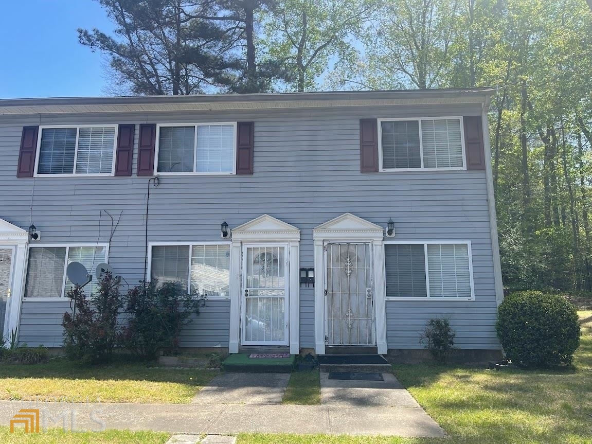 405 Fairburn Road Southwest, Unit 39 Atlanta, GA 30331 - Photo 1 of 1 front view of a house with a yard