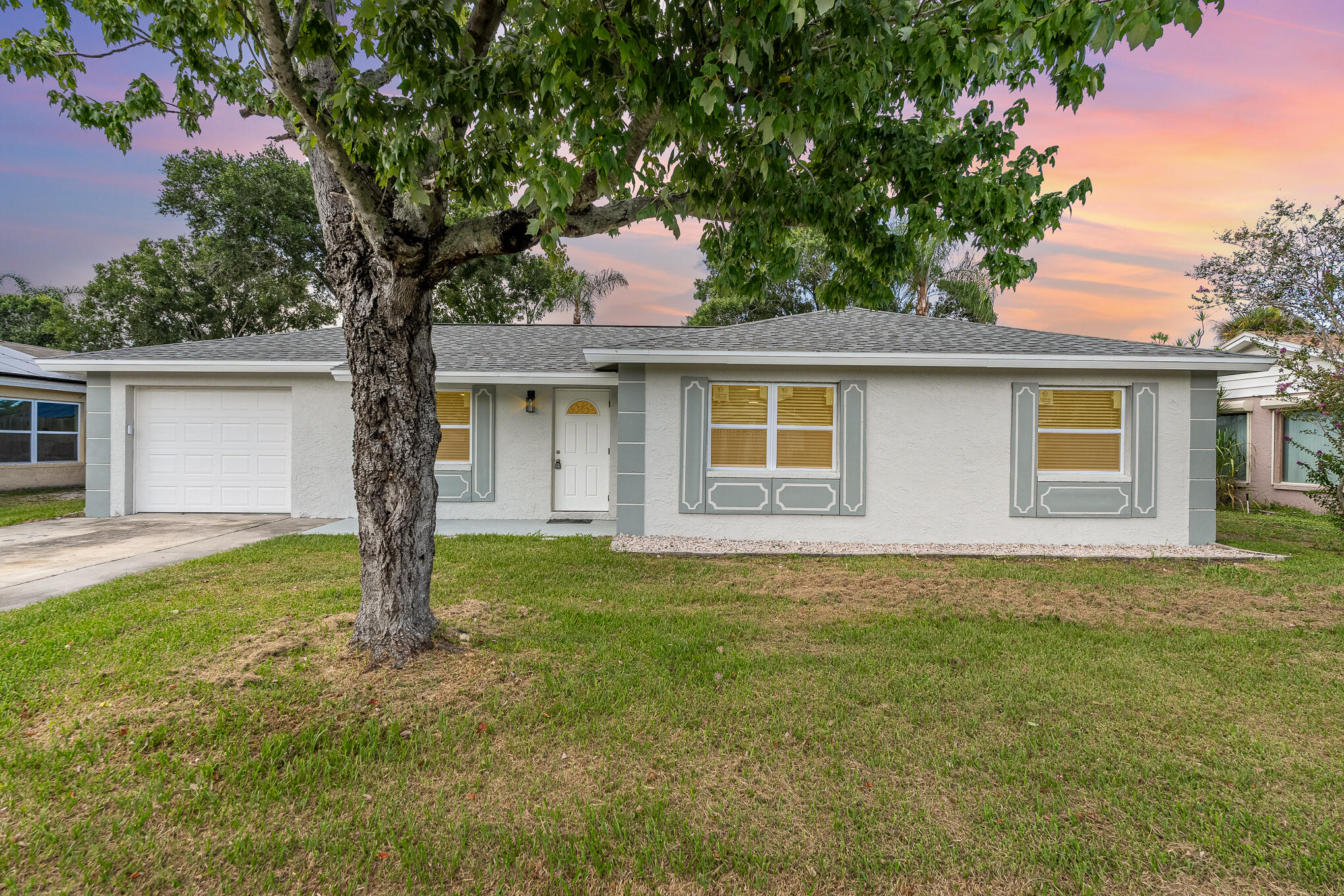 a house with trees in the background