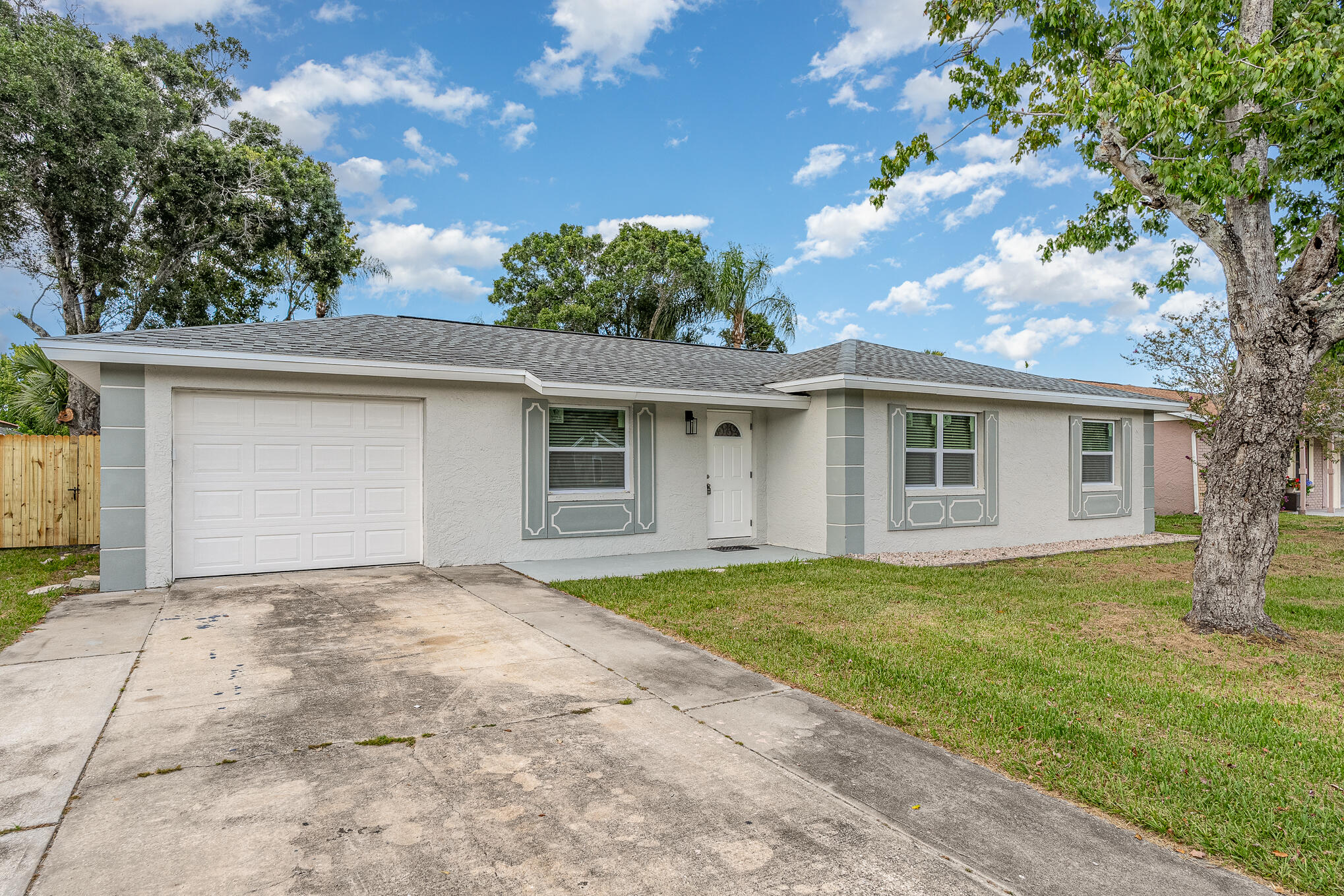 2896 Lancaster Road Melbourne, FL 32935 - Photo 5 of 25 front view of a house with a yard