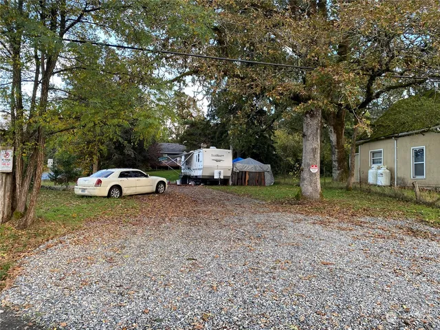 a house with a truck parked in front of a house