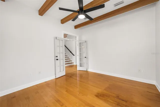 a view of an empty room with stairs