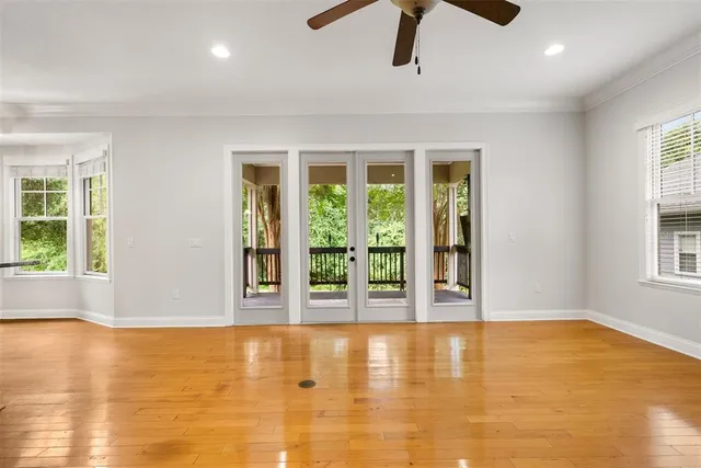 a view of room with window and ceiling fan