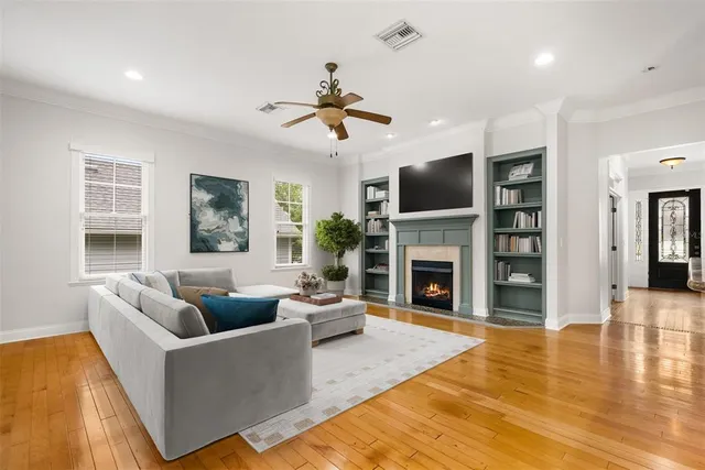 a living room with fireplace furniture and a fireplace