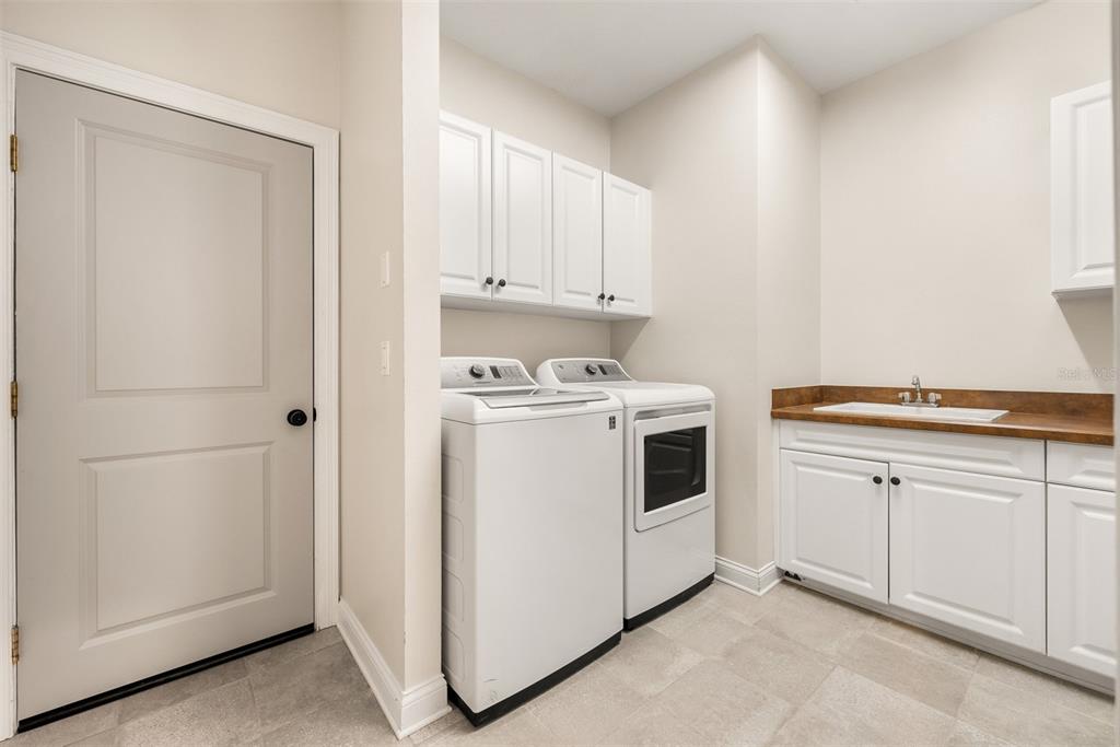 11067 Northwest 18th Road Gainesville, FL 32606 - Photo 29 of 58 a kitchen with white cabinets and white appliances