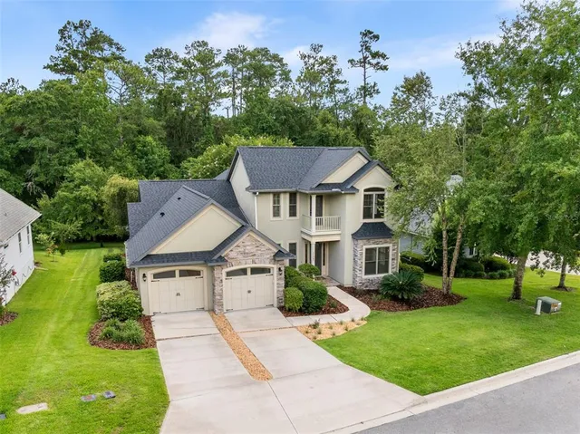 a aerial view of a house with a yard