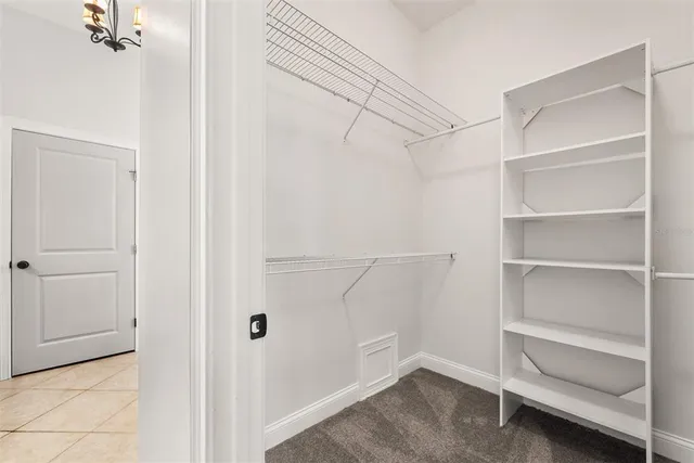 a spacious bathroom with a granite countertop sink a mirror and a