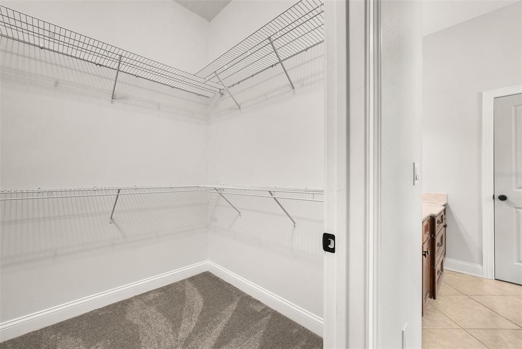 11067 Northwest 18th Road Gainesville, FL 32606 - Photo 34 of 58 a view of a room with racks on the wall