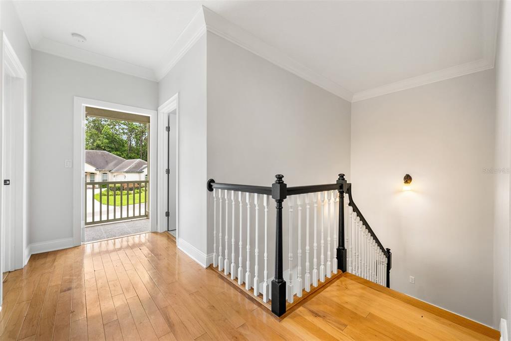 11067 Northwest 18th Road Gainesville, FL 32606 - Photo 37 of 58 a view of an empty room with wooden floor and a window