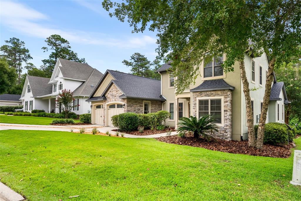11067 Northwest 18th Road Gainesville, FL 32606 - Photo 4 of 58 a front view of house with yard and green space