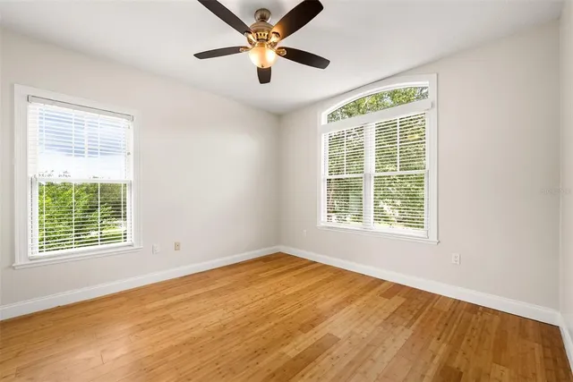 a bed room with a bed and a bookshelf