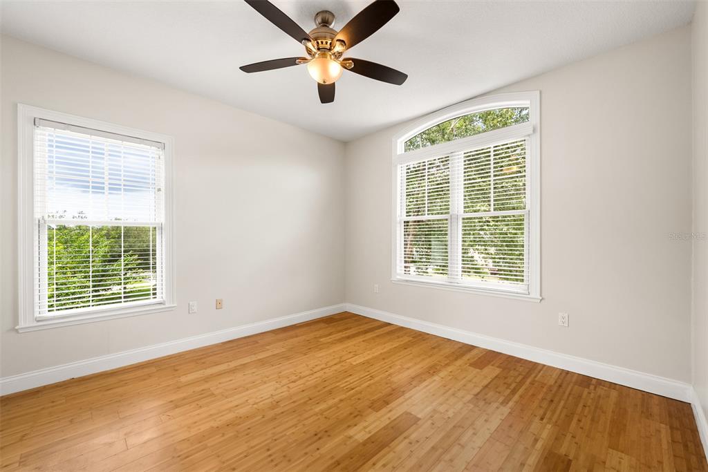 11067 Northwest 18th Road Gainesville, FL 32606 - Photo 41 of 58 a view of an empty room with wooden floor and a window