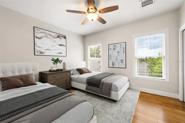a bathroom with a double vanity sink toilet and shower