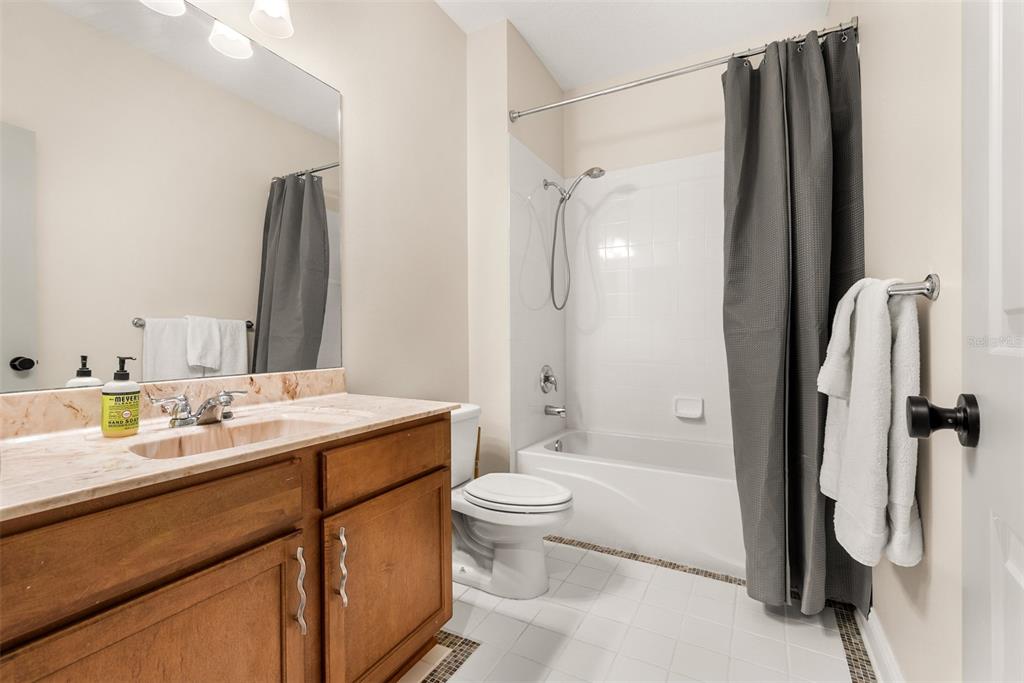 11067 Northwest 18th Road Gainesville, FL 32606 - Photo 50 of 58 a bathroom with a double vanity sink toilet and shower