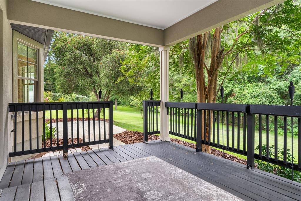 11067 Northwest 18th Road Gainesville, FL 32606 - Photo 51 of 58 a view of balcony with wooden floor