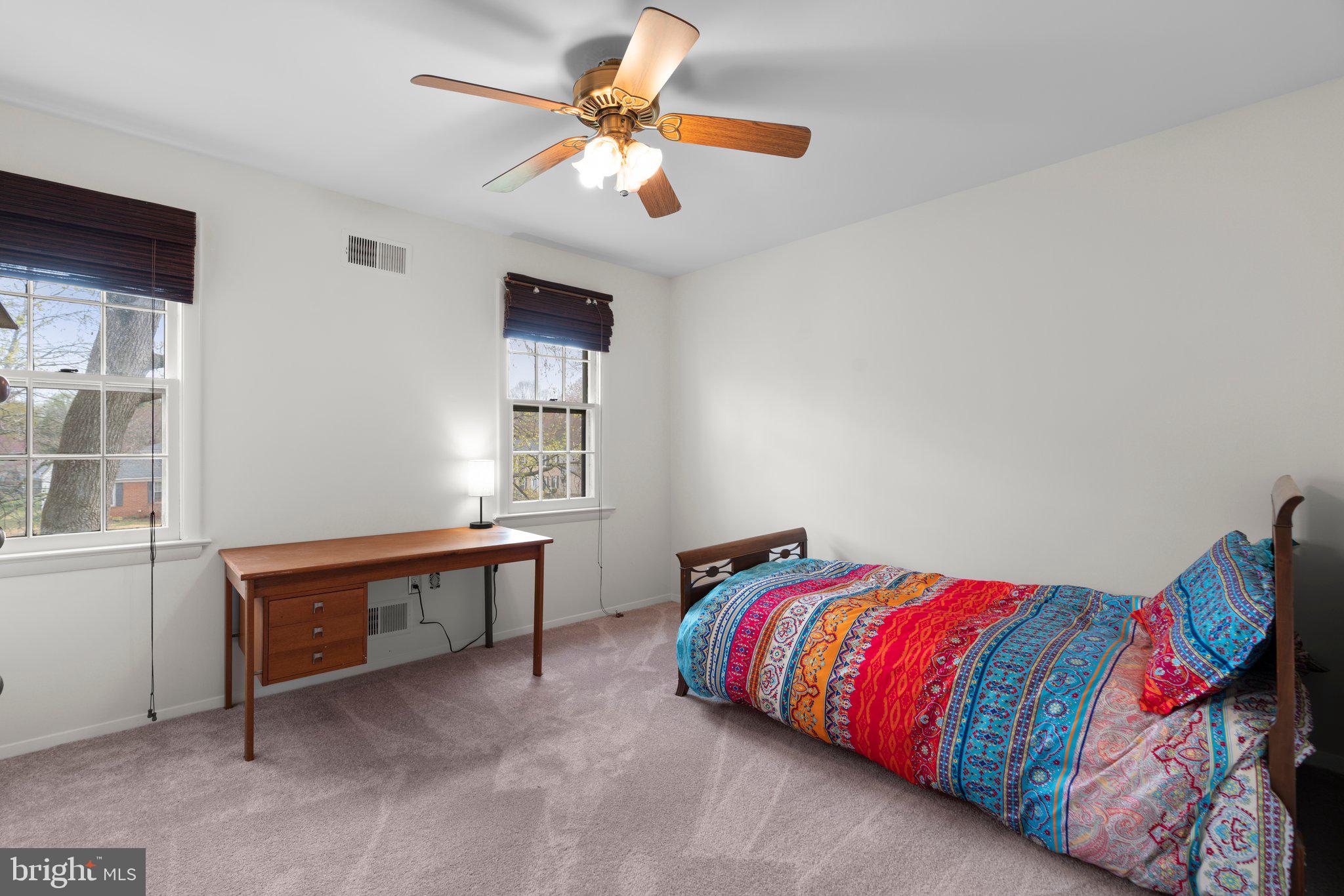 14816 Mistletoe Court Silver Spring, MD 20905 - Photo 17 of 44 a bedroom with a bed and a chandelier