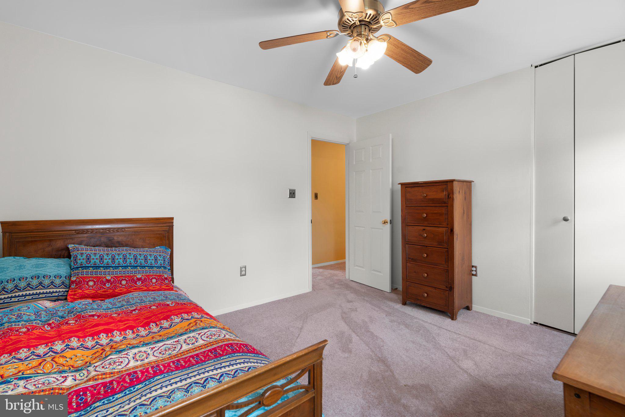 14816 Mistletoe Court Silver Spring, MD 20905 - Photo 18 of 44 a bedroom with a bed and a chandelier