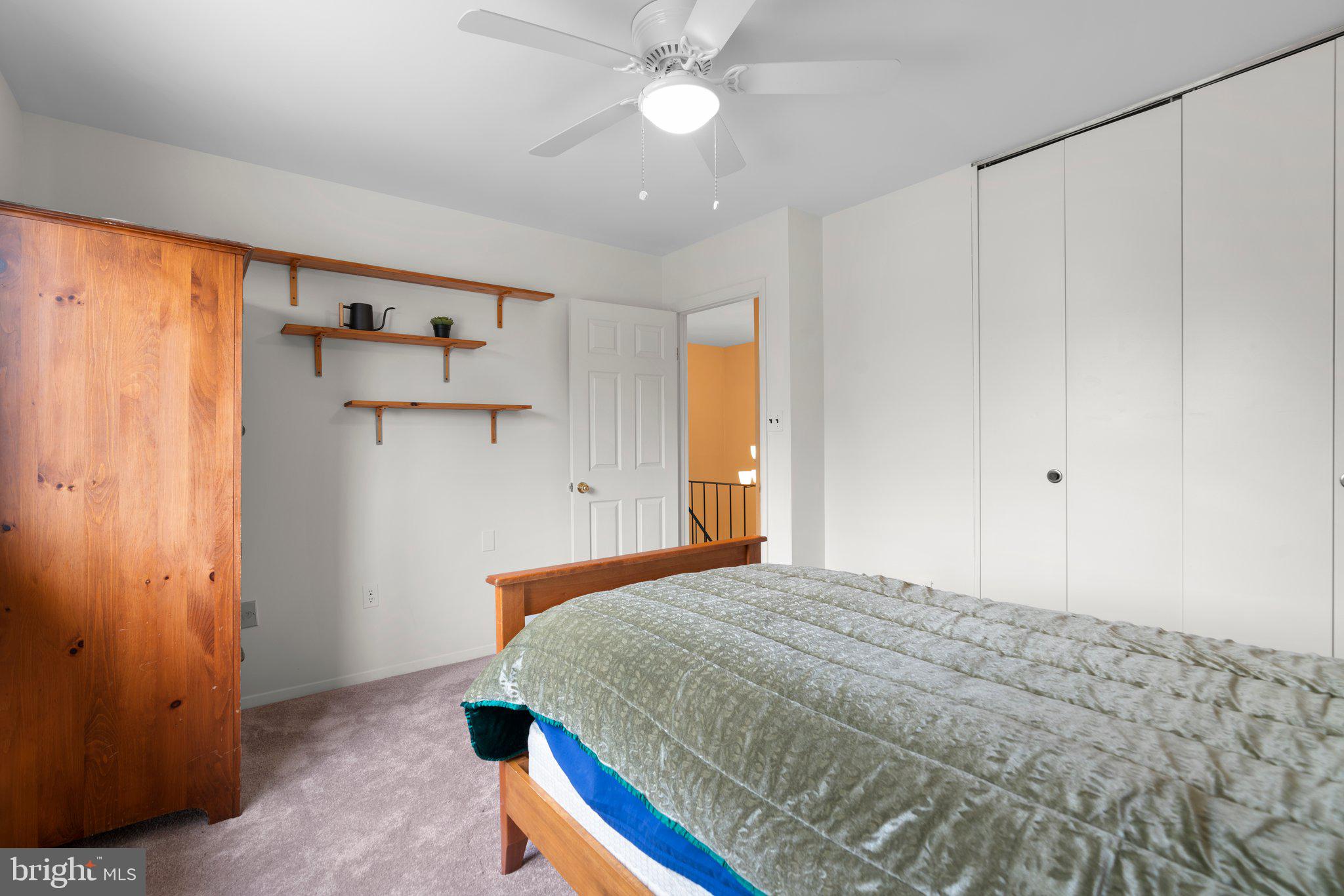 14816 Mistletoe Court Silver Spring, MD 20905 - Photo 20 of 44 a bedroom with a bed and a chandelier