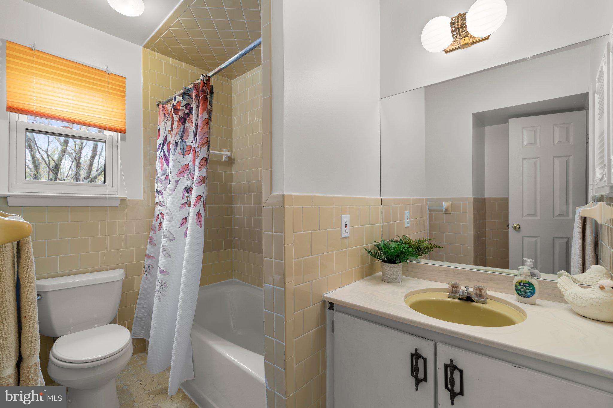 14816 Mistletoe Court Silver Spring, MD 20905 - Photo 23 of 44 a bathroom with a sink a toilet and shower