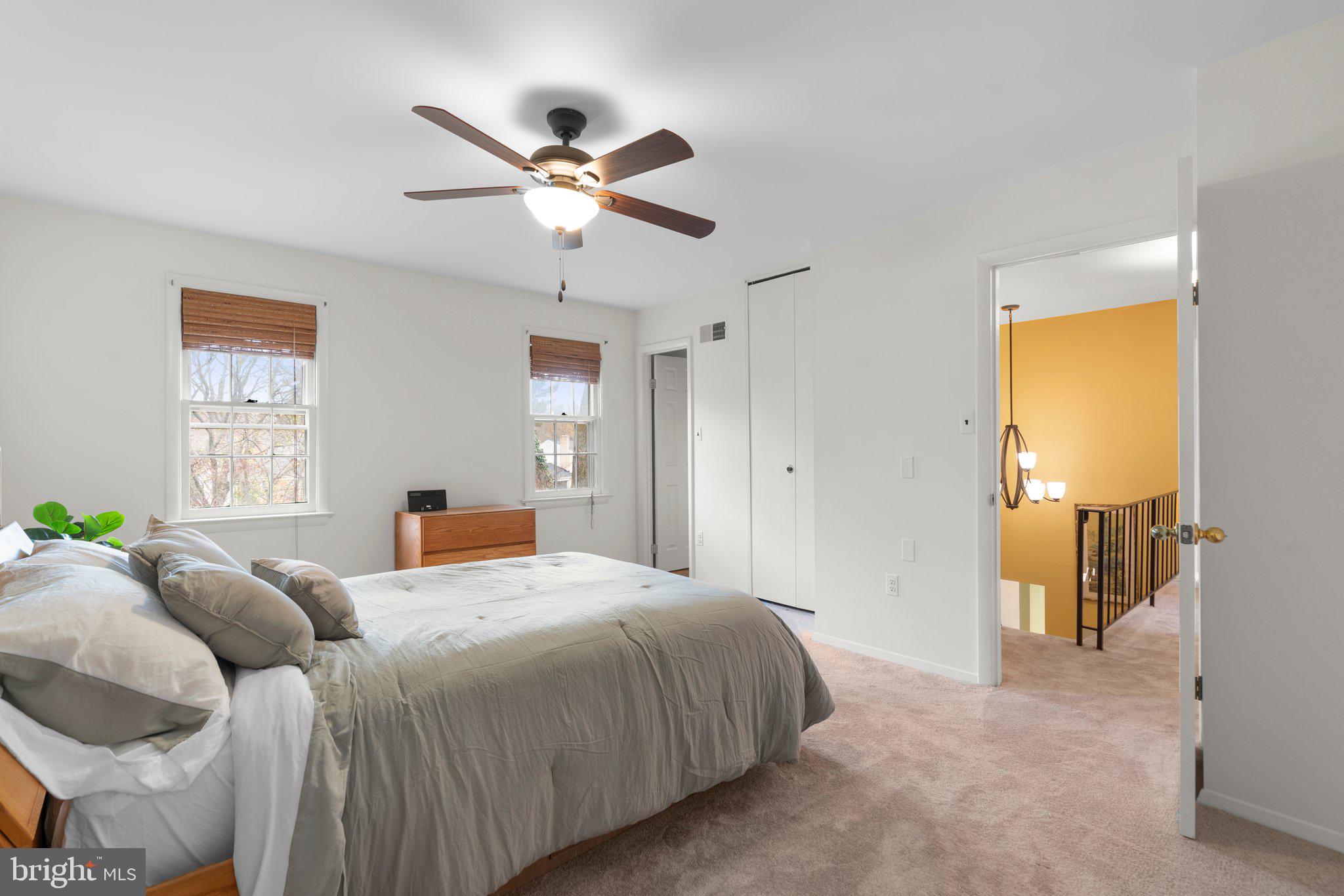14816 Mistletoe Court Silver Spring, MD 20905 - Photo 26 of 44 a bedroom with a bed and a chandelier