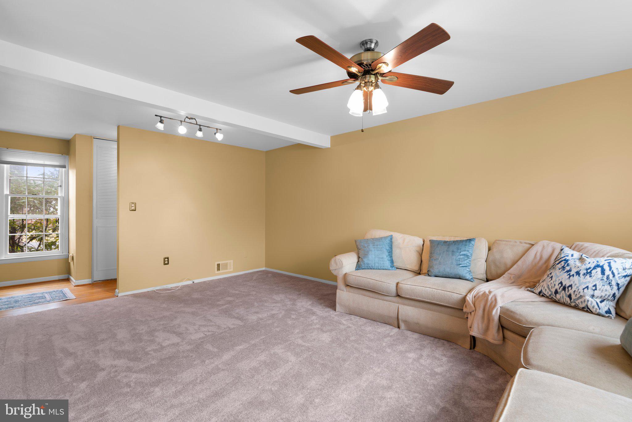 14816 Mistletoe Court Silver Spring, MD 20905 - Photo 7 of 44 a living room with furniture and a ceiling fan
