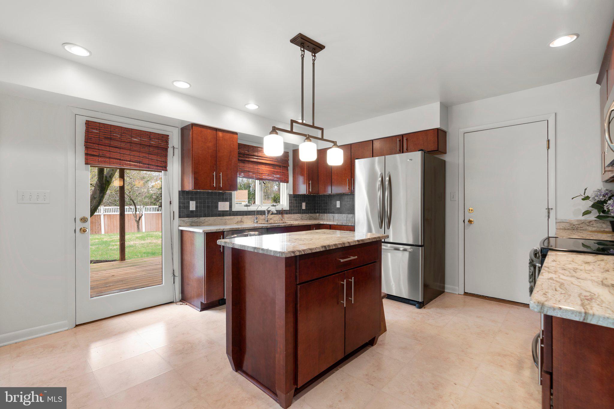 14816 Mistletoe Court Silver Spring, MD 20905 - Photo 9 of 44 a kitchen with stainless steel appliances granite countertop a refrigerator a stove and a sink